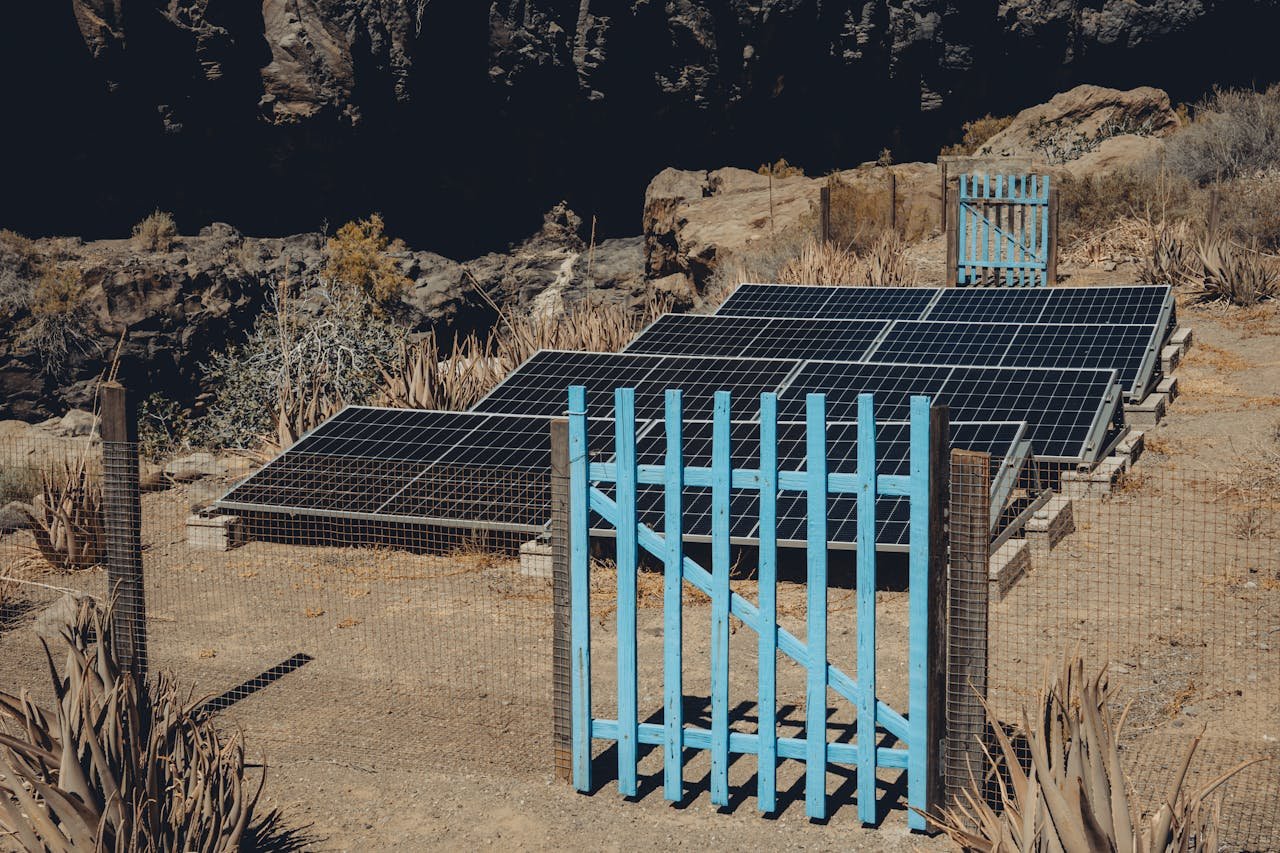 Home Solar panels set in an arid landscape of Alajeró, reflecting renewable energy efforts in Canary Islands.